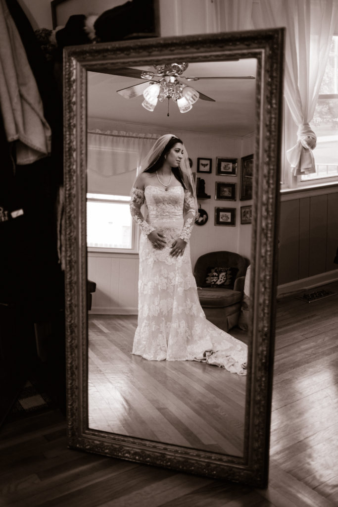 bride reflection of herself in the mirror