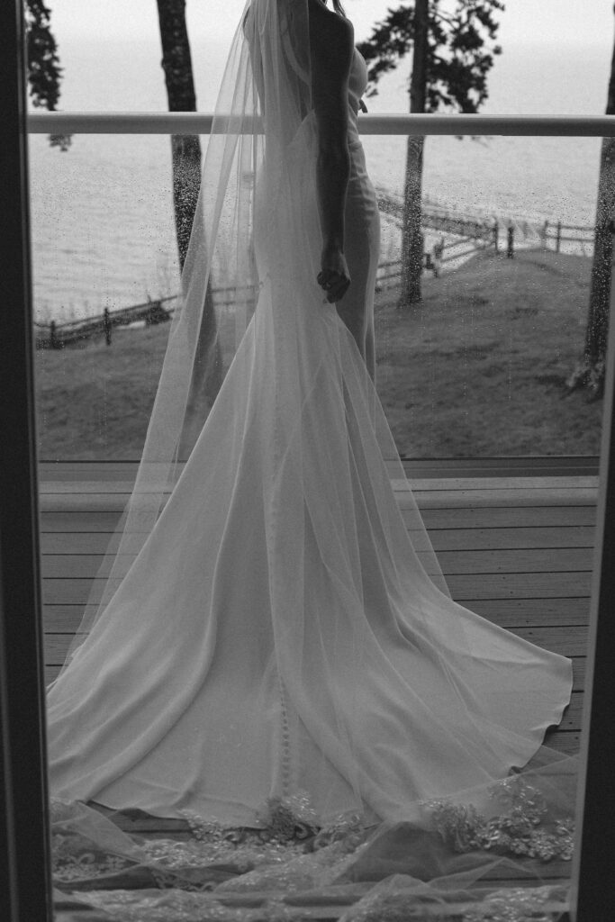 Bride in black and white on balcony in Acadia National Park for adventure elopement