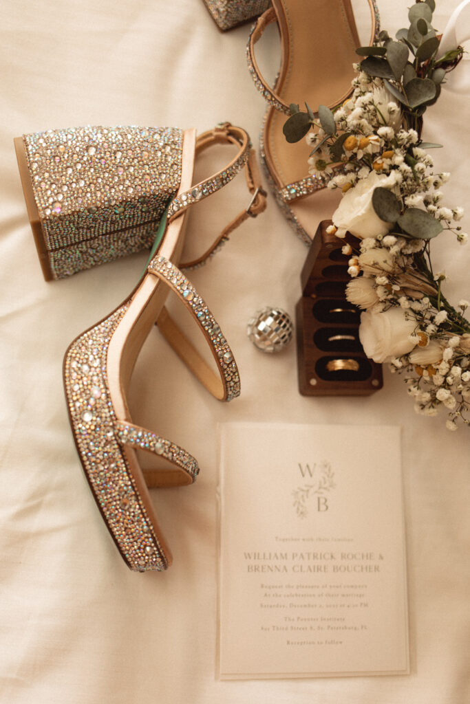 Details of bride's shoes and wedding invitation St. Petersburg