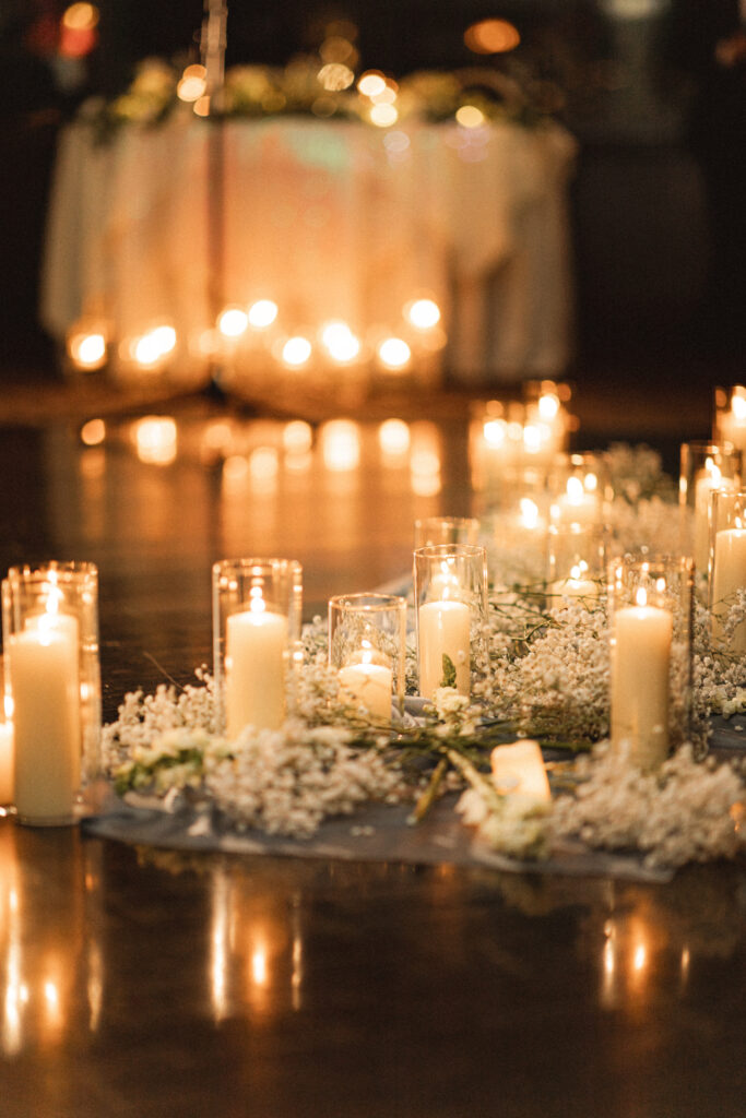 Detail photos of their intimate wedding at Chart House in Weehawken, NJ of their candles for their ceremony