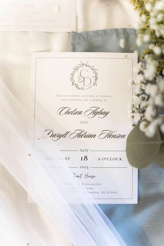 Detail photos of their intimate wedding at Chart House in Weehawken, NJ of their invitation