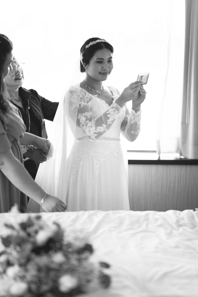 Bride applying final touches before the ceremony. NJ intimate wedding photographer specializing in micro weddings.
