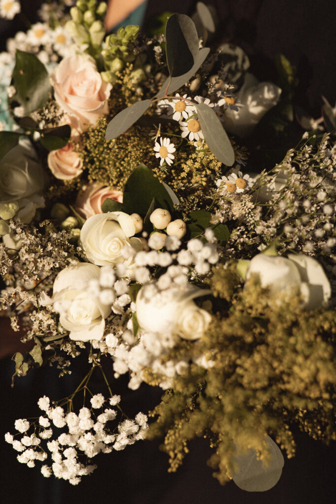 Bouquet with white and pale pink roses. Captured by a New Jersey documentary wedding photographer at a non-traditional wedding with close friends and family
