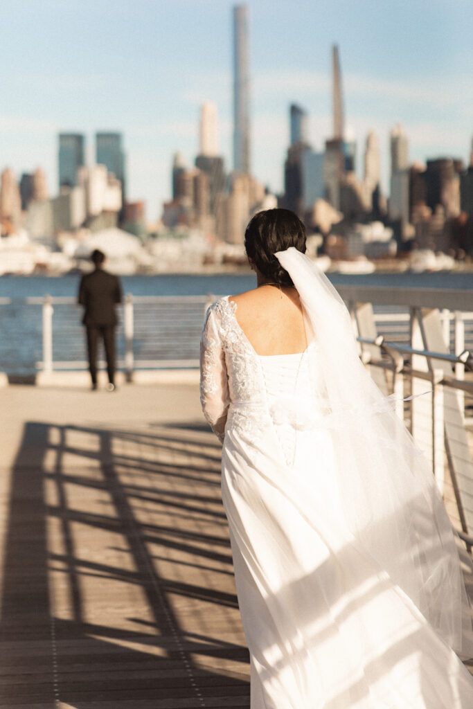 Bride and groom sharing a joyful moment on the pier. NJ wedding photography packages for intimate wedding coverage.
