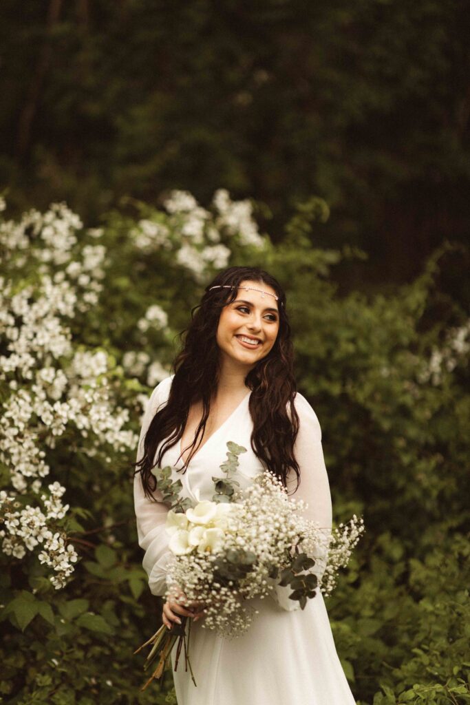 Adventure elopement at Thompson Park in nature and a flower bouquet